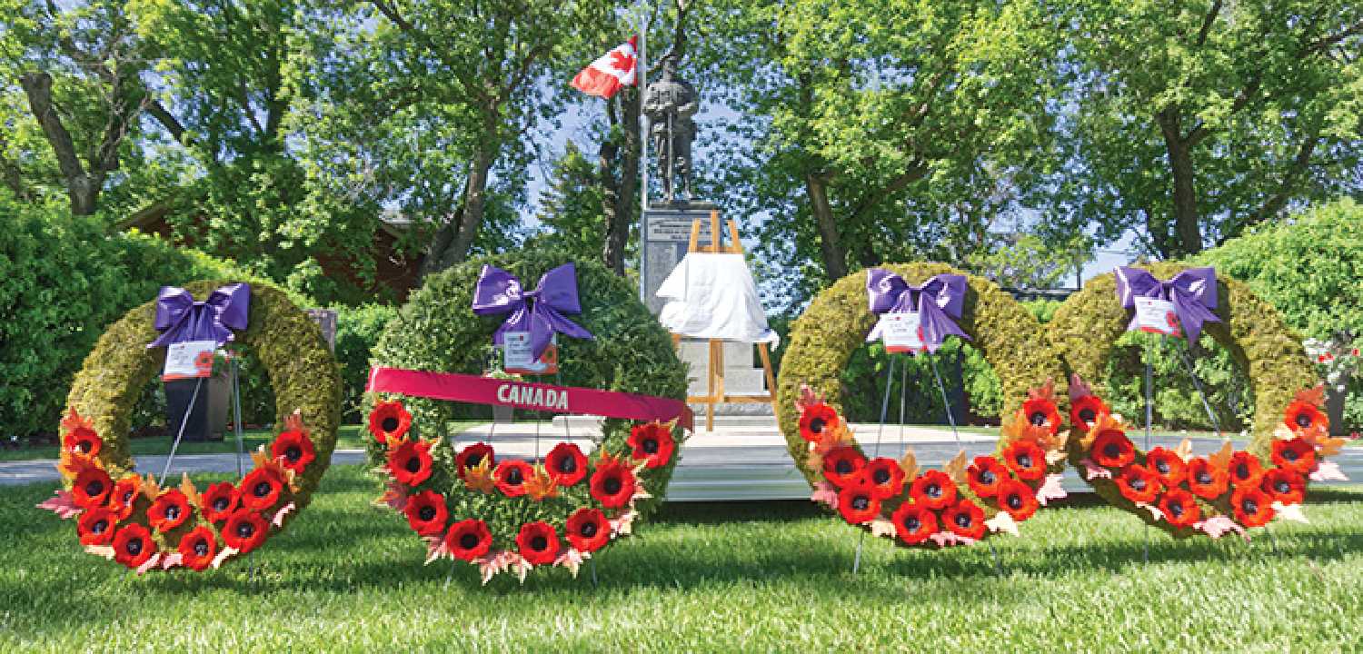 Wreaths await placement at the Moosomin Cenotaph moments before dignitaries fill the grounds.